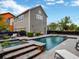 Backyard oasis with pool, spa, patio, and landscaping, perfect for outdoor entertaining and relaxation at 14025 Hench Ln, Orlando, FL 32827