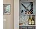 The bar area showcases a wine rack, mosaic tile backsplash, and upper and lower cabinets at 14025 Hench Ln, Orlando, FL 32827