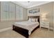Bedroom features neutral colors, carpet floors, ample natural light and decorative shutters at 14025 Hench Ln, Orlando, FL 32827