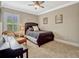 Bedroom features neutral colors, carpet floors, ample natural light, a ceiling fan, and a piano at 14025 Hench Ln, Orlando, FL 32827