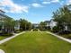 Beautiful community with a central green space, walkways, and well-maintained landscaping for a serene neighborhood feel at 14025 Hench Ln, Orlando, FL 32827