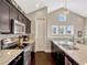 Well-equipped kitchen with stainless steel appliances, dark cabinets, and sleek countertops at 14025 Hench Ln, Orlando, FL 32827