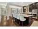 This spacious kitchen features dark wood floors, a large kitchen island with seating, and stainless steel appliances at 14025 Hench Ln, Orlando, FL 32827