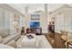 Open concept living room featuring dark wood floors, plantation shutters and high ceilings at 14025 Hench Ln, Orlando, FL 32827