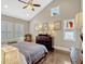 Bright main bedroom features plantation shutters, high ceilings, and dark wood floors at 14025 Hench Ln, Orlando, FL 32827