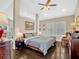 Inviting main bedroom with hardwood floors, plantation shutters, and tasteful decor at 14025 Hench Ln, Orlando, FL 32827