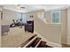 View of a staircase leading down into a carpeted room with exercise equipment at 14025 Hench Ln, Orlando, FL 32827