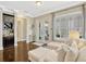 The sun room features hardwood floors, a bar area, French doors to the patio, and shuttered windows at 14025 Hench Ln, Orlando, FL 32827