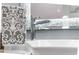 Close up of a chrome bathroom faucet and textured towel in a modern luxury setting at 1450 Belfiore Way, Windermere, FL 34786