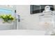Close up of a modern faucet on a soaking tub with integrated shower fixture at 1450 Belfiore Way, Windermere, FL 34786