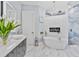Elegant bathroom featuring a freestanding tub, stylish fixtures, and textured wall detailing at 1450 Belfiore Way, Windermere, FL 34786