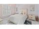 Inviting bedroom featuring marble floors, large window, and comfortable furnishings for relaxation at 1450 Belfiore Way, Windermere, FL 34786