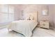 Cozy bedroom with a comfortable bed, two nightstands and plush pillows at 1450 Belfiore Way, Windermere, FL 34786
