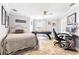 Inviting bedroom with neutral tones, large bed, home office, and entertainment setup, perfect for relaxation at 1450 Belfiore Way, Windermere, FL 34786