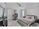 Well-lit bedroom with a modern gray bed frame, desk area, and light-colored walls at 1450 Belfiore Way, Windermere, FL 34786