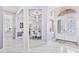Elegant foyer with marble floors and a view of the dining area at 1450 Belfiore Way, Windermere, FL 34786