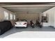 Spacious three-car garage with a sleek epoxy floor and ample storage at 1450 Belfiore Way, Windermere, FL 34786