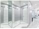 Hallway with three-way mirror and barn door leading to the luxurious bathroom at 1450 Belfiore Way, Windermere, FL 34786