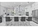 Spacious kitchen with large island, marble countertops, and stainless steel appliances at 1450 Belfiore Way, Windermere, FL 34786