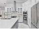 Well-equipped kitchen boasts a large island and modern appliances at 1450 Belfiore Way, Windermere, FL 34786