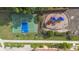 Aerial view of a community playground and basketball court for outdoor recreation at 1450 Belfiore Way, Windermere, FL 34786