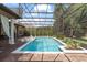 Sparkling pool with screened-in enclosure, fountains, and statues surrounded by lush landscaping at 1450 Belfiore Way, Windermere, FL 34786