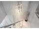 Elegant staircase with modern lighting and a sleek design, enhancing the home's contemporary feel at 1450 Belfiore Way, Windermere, FL 34786