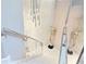 Modern staircase with glass railing and chrome accents, complemented by a textured wall and unique art pieces at 1450 Belfiore Way, Windermere, FL 34786