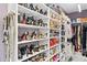 Spacious walk-in closet featuring custom shelving and ample storage for shoes and clothing at 1450 Belfiore Way, Windermere, FL 34786
