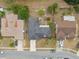 Overhead shot of a well-maintained property featuring a dark roof and a private driveway at 1503 Canterbury Cir, Casselberry, FL 32707