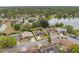 Aerial view of property highlights its location in a mature neighborhood close to a lake and community amenities at 1503 Canterbury Cir, Casselberry, FL 32707