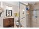 Bathroom with tile shower, modern fixtures, and a vanity with a sink at 1503 Canterbury Cir, Casselberry, FL 32707