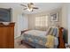 Comfortable bedroom featuring a ceiling fan, closet, and natural lighting at 1503 Canterbury Cir, Casselberry, FL 32707
