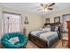 Relaxing bedroom with a ceiling fan, accent chair, and a cozy atmosphere at 1503 Canterbury Cir, Casselberry, FL 32707