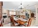 Elegant dining room with a large table set for a meal and views into the fireplace and living room at 1503 Canterbury Cir, Casselberry, FL 32707