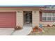Charming home featuring a well-maintained front entrance, complemented by colorful landscaping and a secure ADT system at 1503 Canterbury Cir, Casselberry, FL 32707