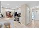 Bright kitchen featuring white cabinets, stainless steel appliances, and a breakfast bar, seamlessly connecting to the dining area at 1503 Canterbury Cir, Casselberry, FL 32707