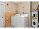 An interior laundry room showcases a dryer, a washer, and a water heater unit, equipped for everyday convenience at 1503 Canterbury Cir, Casselberry, FL 32707