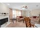 Inviting living room with fireplace, plush sofas, ceiling fan, and bright natural light at 1503 Canterbury Cir, Casselberry, FL 32707