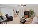 Comfortable living room featuring tile floors, with an open concept view of the kitchen and dining area at 1503 Canterbury Cir, Casselberry, FL 32707