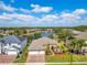 Beautiful home with a three-car garage in a community featuring a tranquil lake and fountain at 16313 Birchwood Way, Orlando, FL 32828