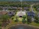 This aerial view shows the home's backyard, mature landscaping and proximity to the lake at 16313 Birchwood Way, Orlando, FL 32828