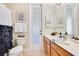 Bright bathroom with a modern sink and vanity, art and a unique curtain at 16313 Birchwood Way, Orlando, FL 32828