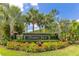 Well-maintained community entrance sign surrounded by manicured landscaping at 16313 Birchwood Way, Orlando, FL 32828