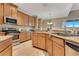 Well-equipped kitchen with granite countertops, modern stainless steel appliances, and ample cabinet space at 16313 Birchwood Way, Orlando, FL 32828