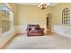 Cozy living area with hardwood floors, an arched doorway, and abundant natural light from the windows at 16313 Birchwood Way, Orlando, FL 32828