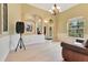Spacious living room area featuring high ceilings, natural light, and an open floor plan at 16313 Birchwood Way, Orlando, FL 32828