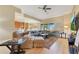 Spacious open floorplan with light wood floors and a view into the living room and kitchen at 16313 Birchwood Way, Orlando, FL 32828