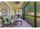 Relaxing screened-in patio with comfortable seating and outdoor grill at 16313 Birchwood Way, Orlando, FL 32828