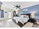 Cozy main bedroom with stylish decor, a ceiling fan, and a private door to the outside at 171 Mcleods Way, Winter Springs, FL 32708